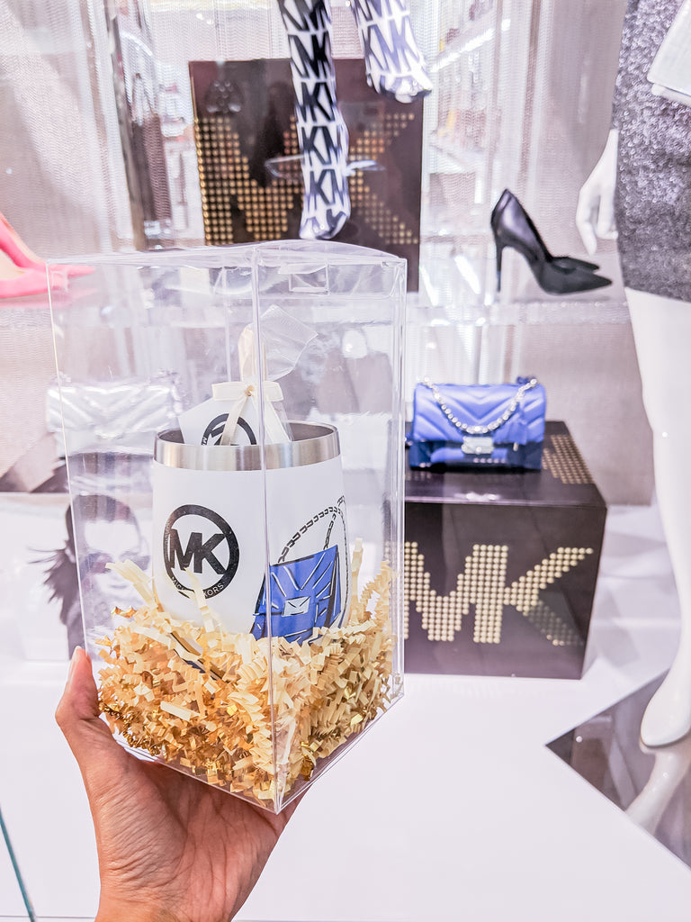 Curated Dry Goods for Michael Kors in front of their retail store window
