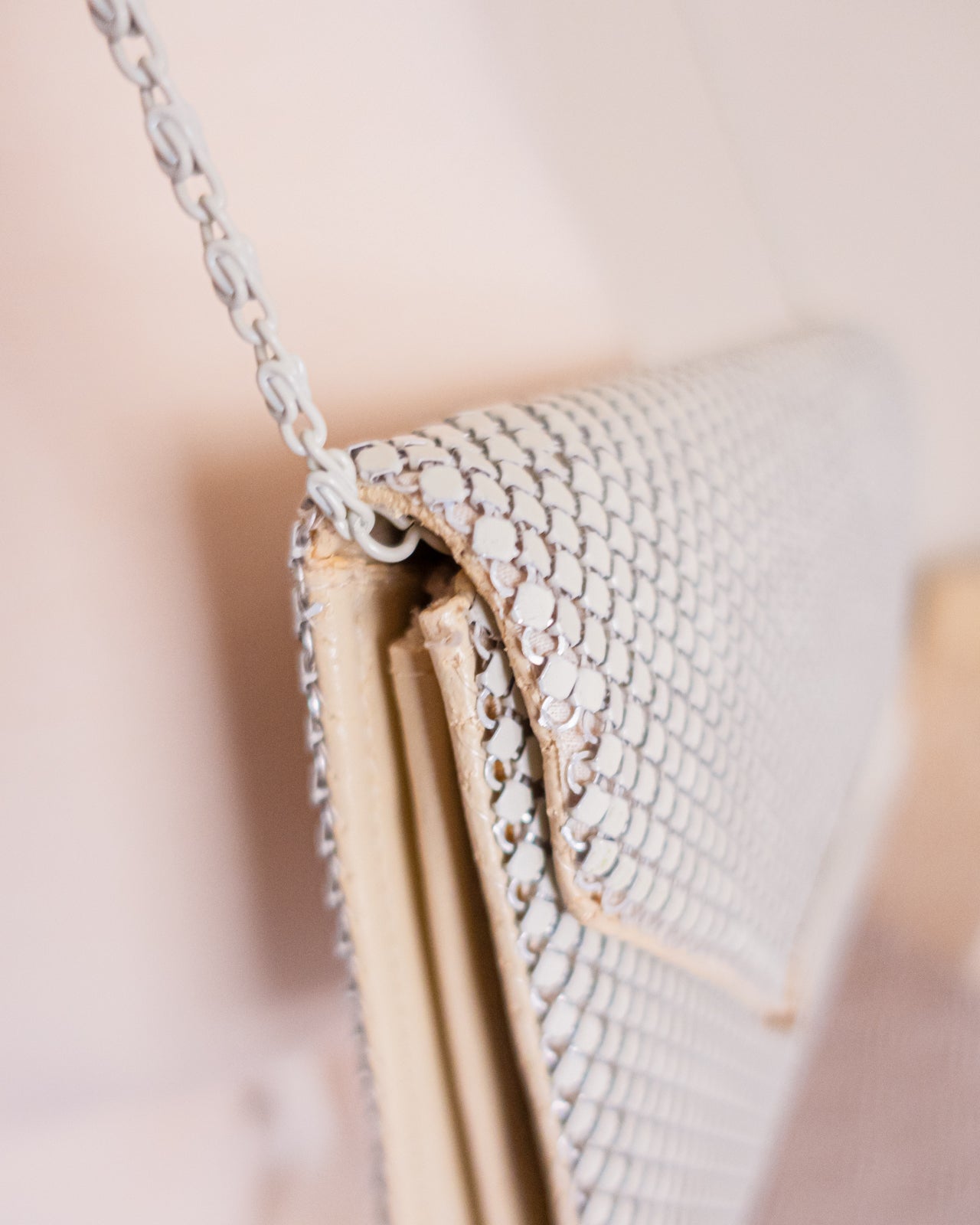 Vintage white chainmail crossbody clutch with gold detail and strap