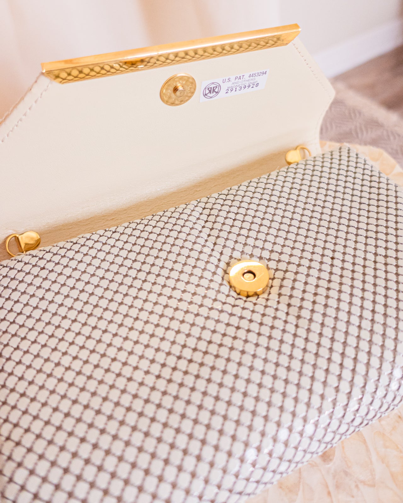 Vintage white chainmail crossbody clutch with gold detail and strap