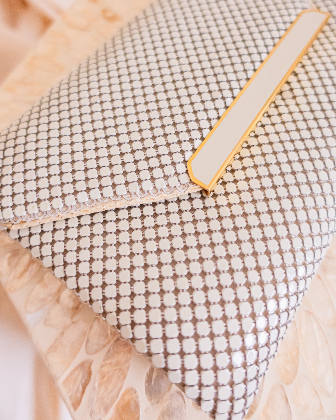 Vintage white chainmail crossbody clutch with gold detail and strap