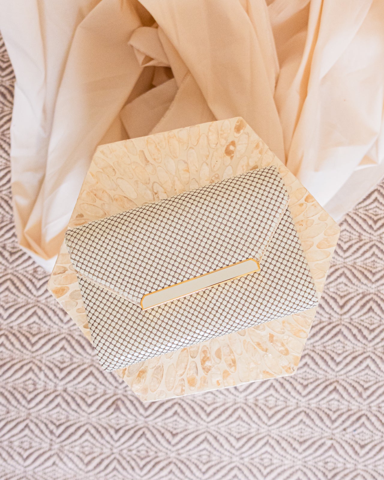 Vintage white chainmail crossbody clutch with gold detail and strap